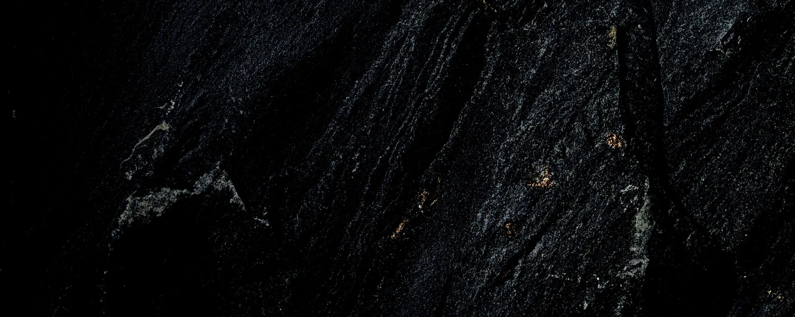 Black marble with subtle blue, white, and gold veining