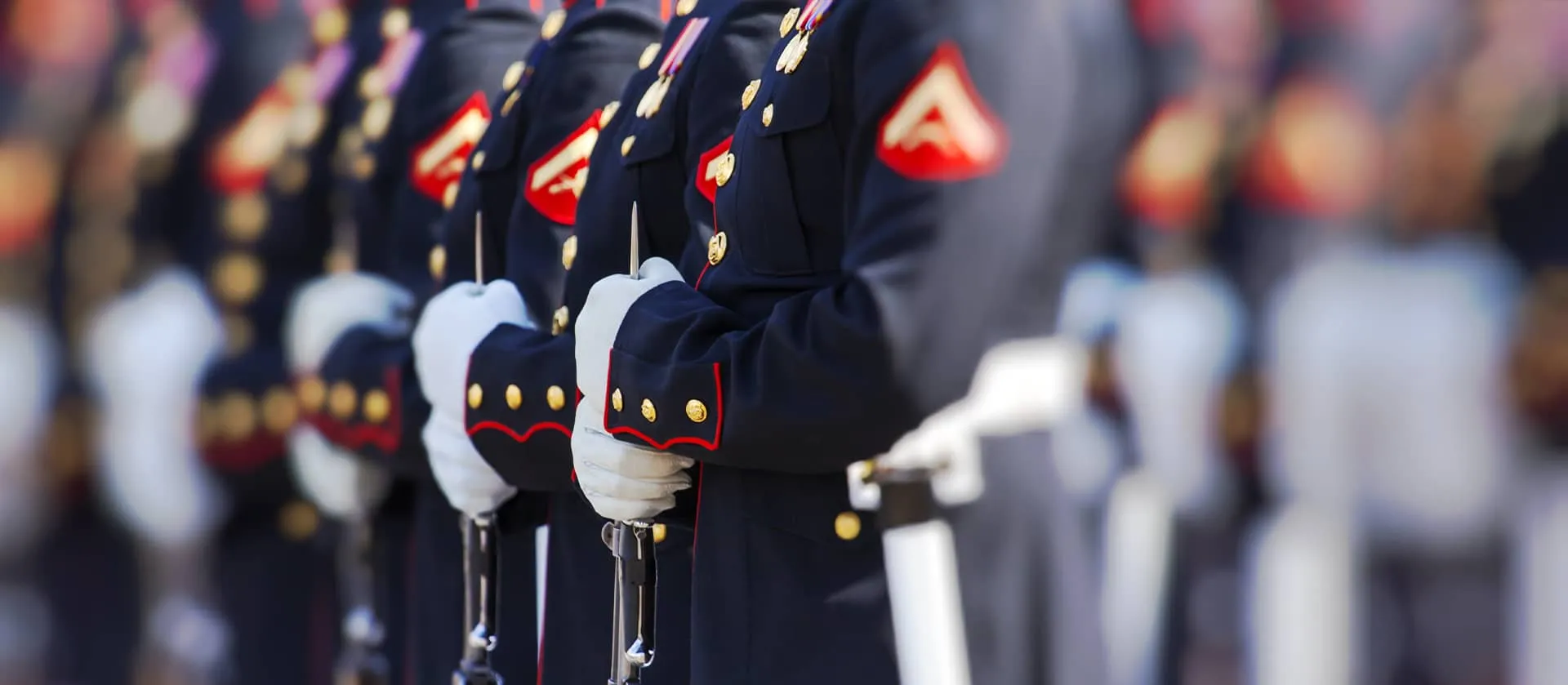 Marines in dress blues standing in formation