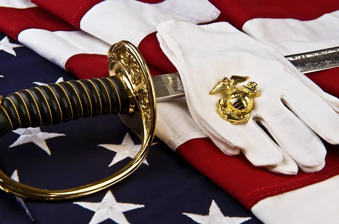 Marine Corps ceremonial sword, gloves, and Eagle, Globe and Anchor emblem